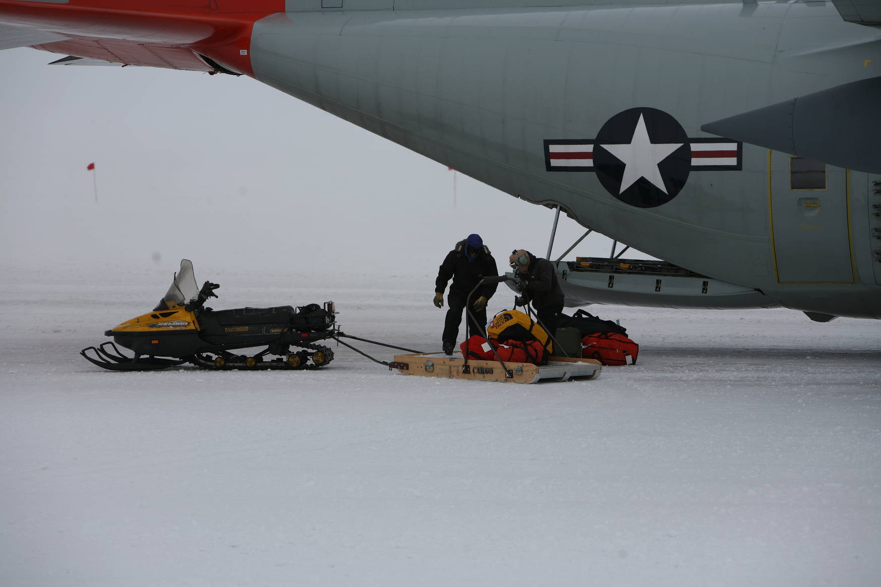 Passenger bags are brought to the aircraft by skimobile.