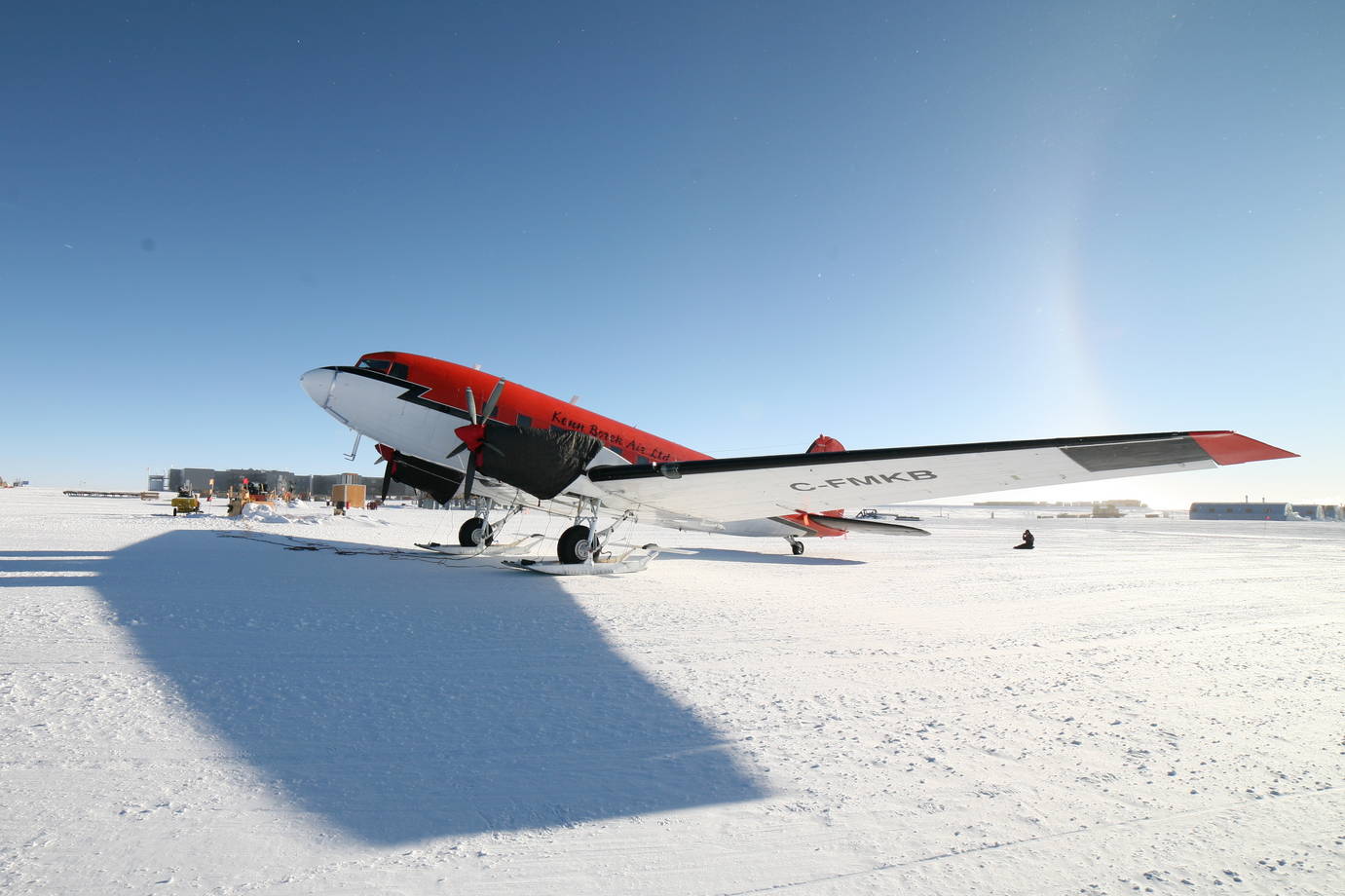 A Basler aircraft parked in front of the south pole station.