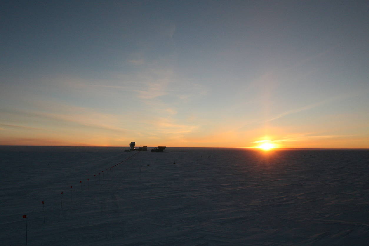 The South Pole Telescope and the setting sun.