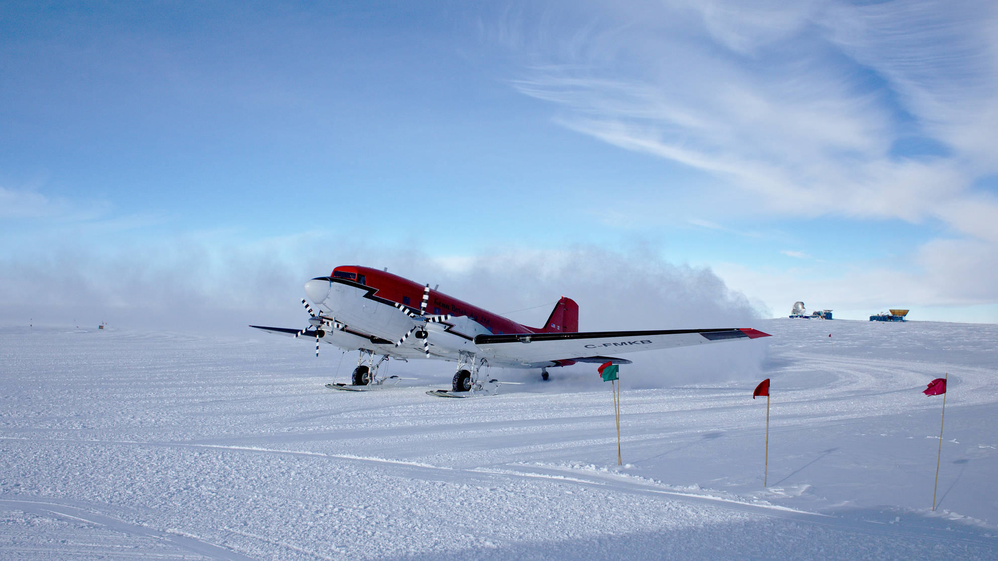Basler arriving at south pole. In the background the South Pole Telescope, BICEP, and SPUD